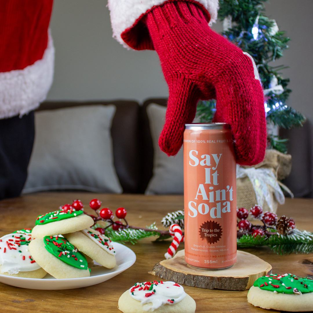 santa clauss grabbing a say it aint soda